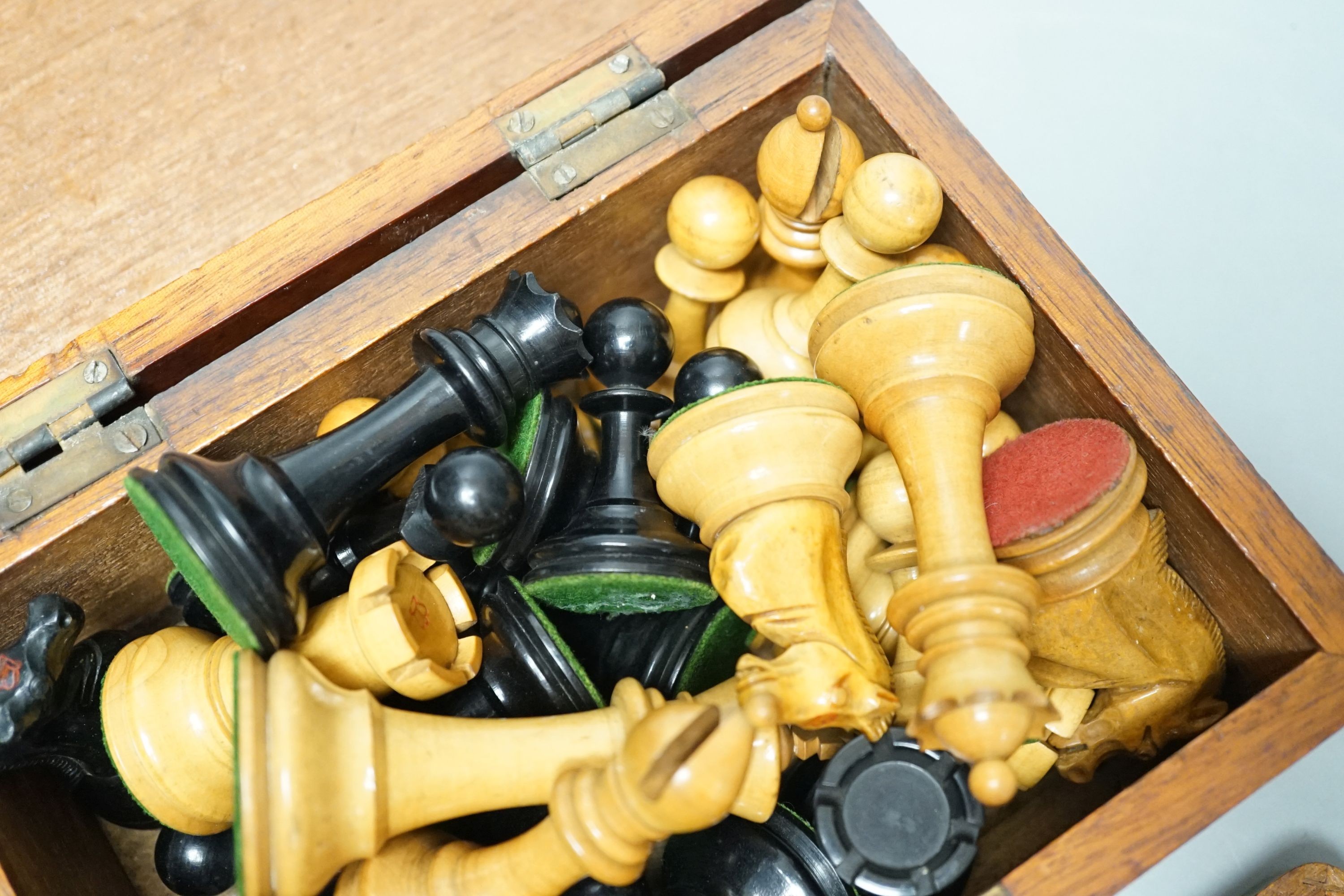A Staunton chess set, some associate pieces and a miniature chess set. King height - 9cm